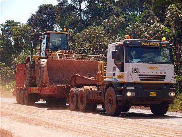 Iveco 6x4 tractor head with lowbed at work in Suriname South America.
