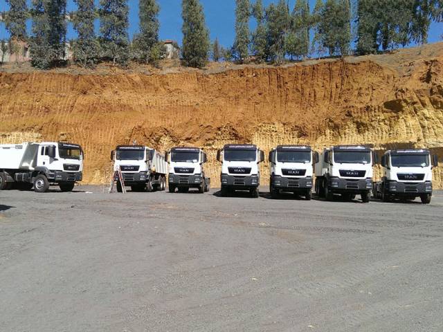 Man tipper trucks ready for work in Burkina Faso Africa.