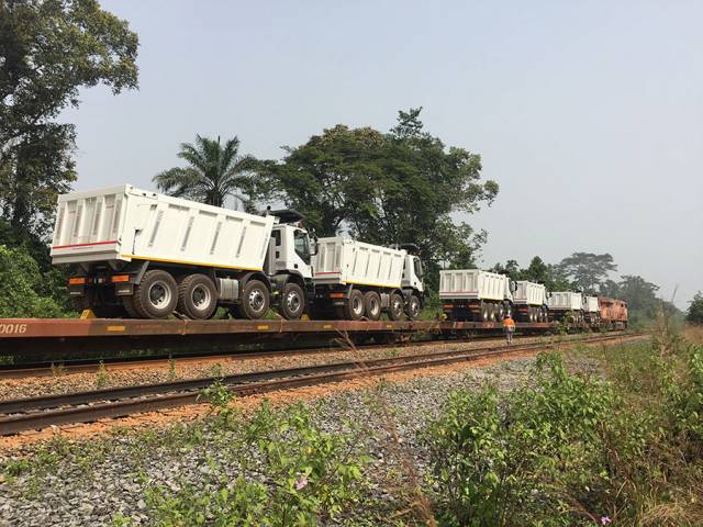 Iveco AD410T44H 8x4 Cantoni tipper trucks on railroad transport in West Africa.